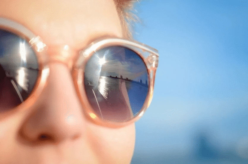 woman wearing sunglasses to protect herself against the glare