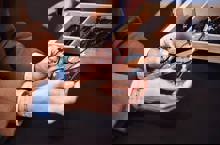 Holding Two Pairs Of Spectacles