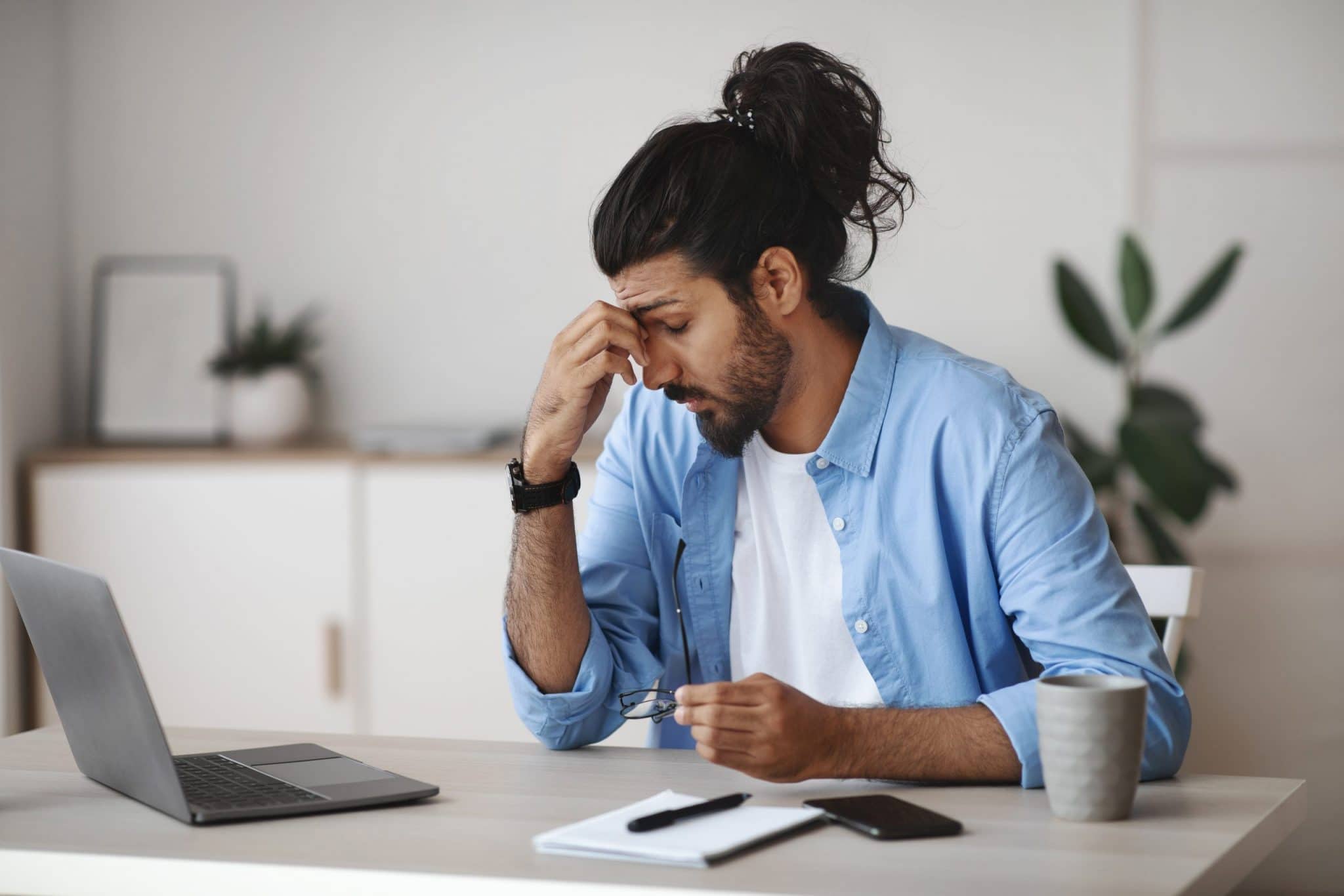 man suffering from eye fatigue