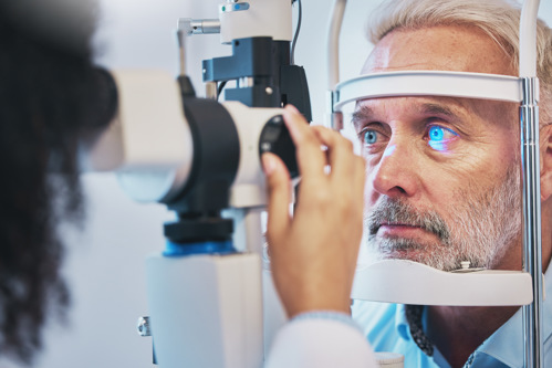Optometrist carrying out an regular eye exam