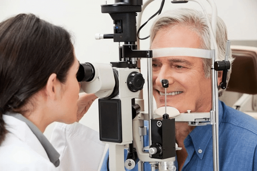 man having his eyes tested by an optician