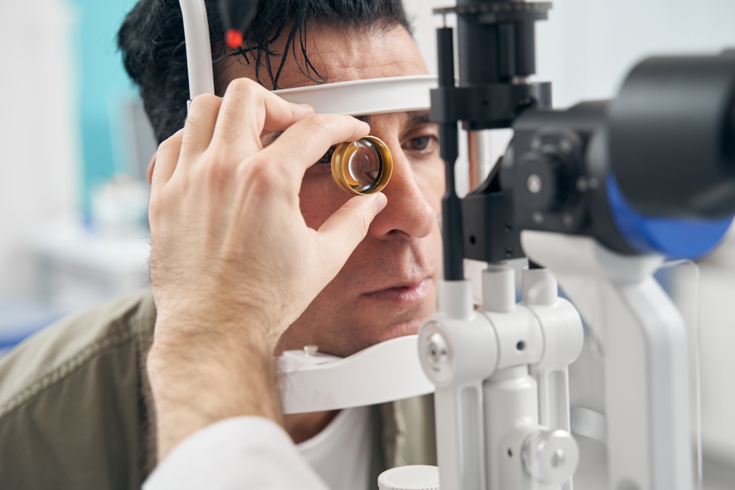 man having his eyes tested for aneurysm