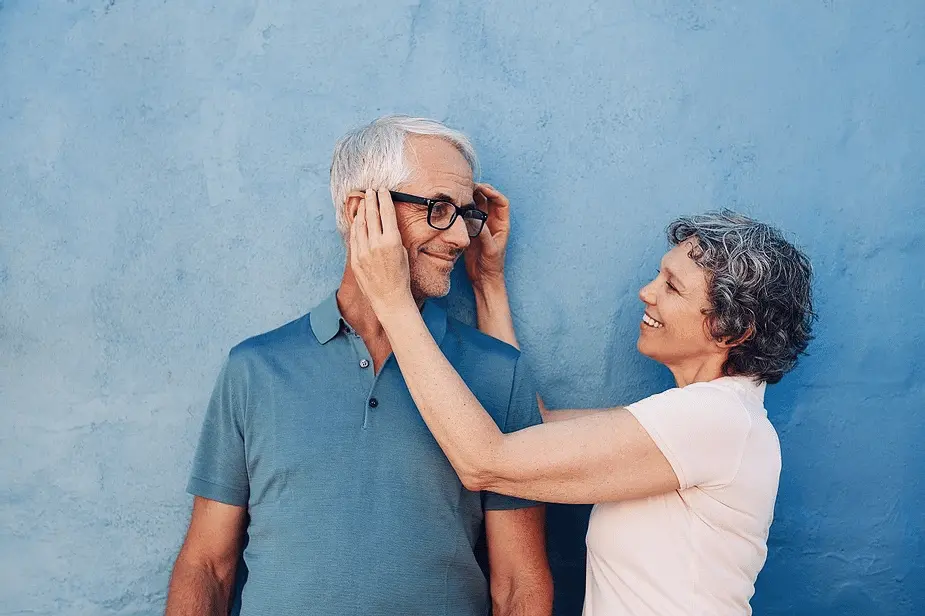 old couple putting on glasses
