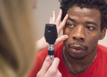 Doctor Examining Young Mans Eye RBPXR6F 1024X683