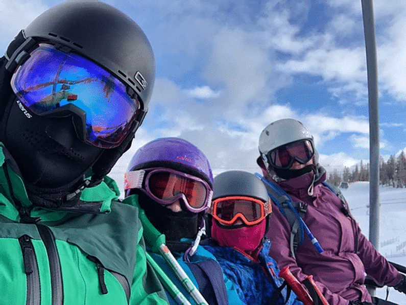 family wearing ski goggles